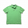 Green polo shirt with a brand logo