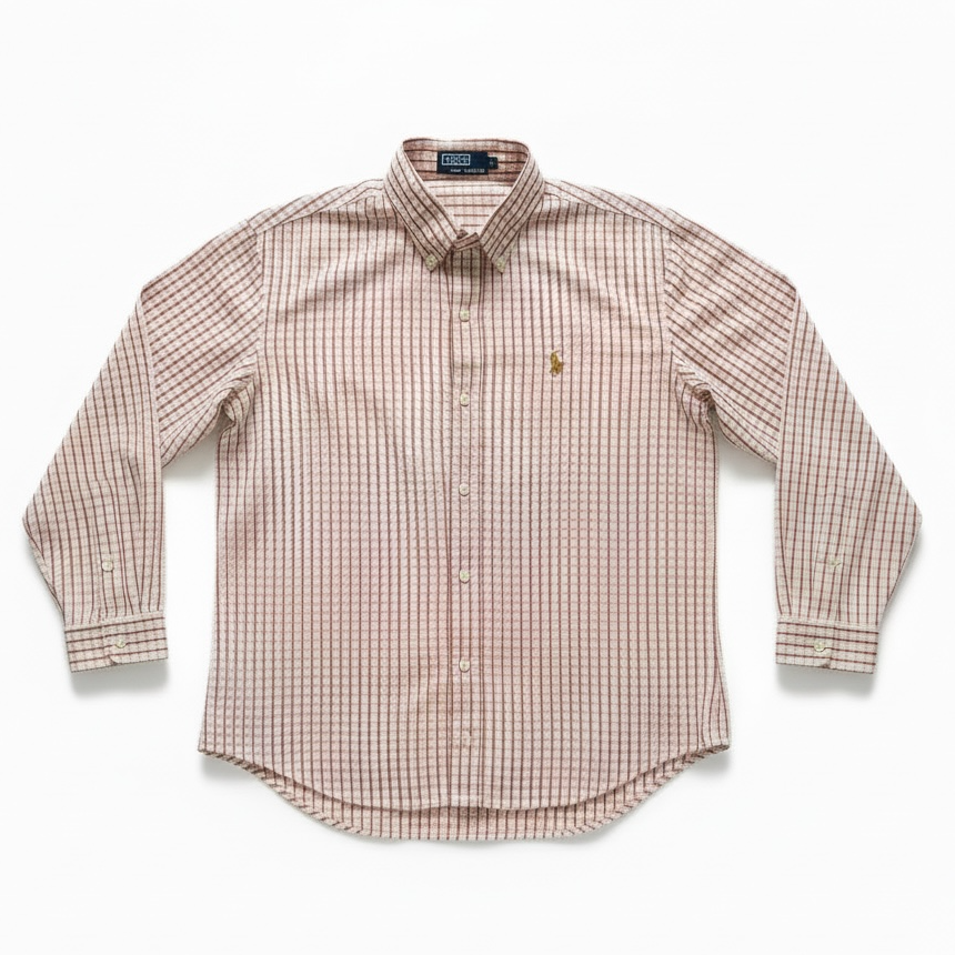 A long-sleeve button-down shirt in a fine pink and white gingham check pattern, featuring a small embroidered polo player logo on the left chest, laid flat against a white background.